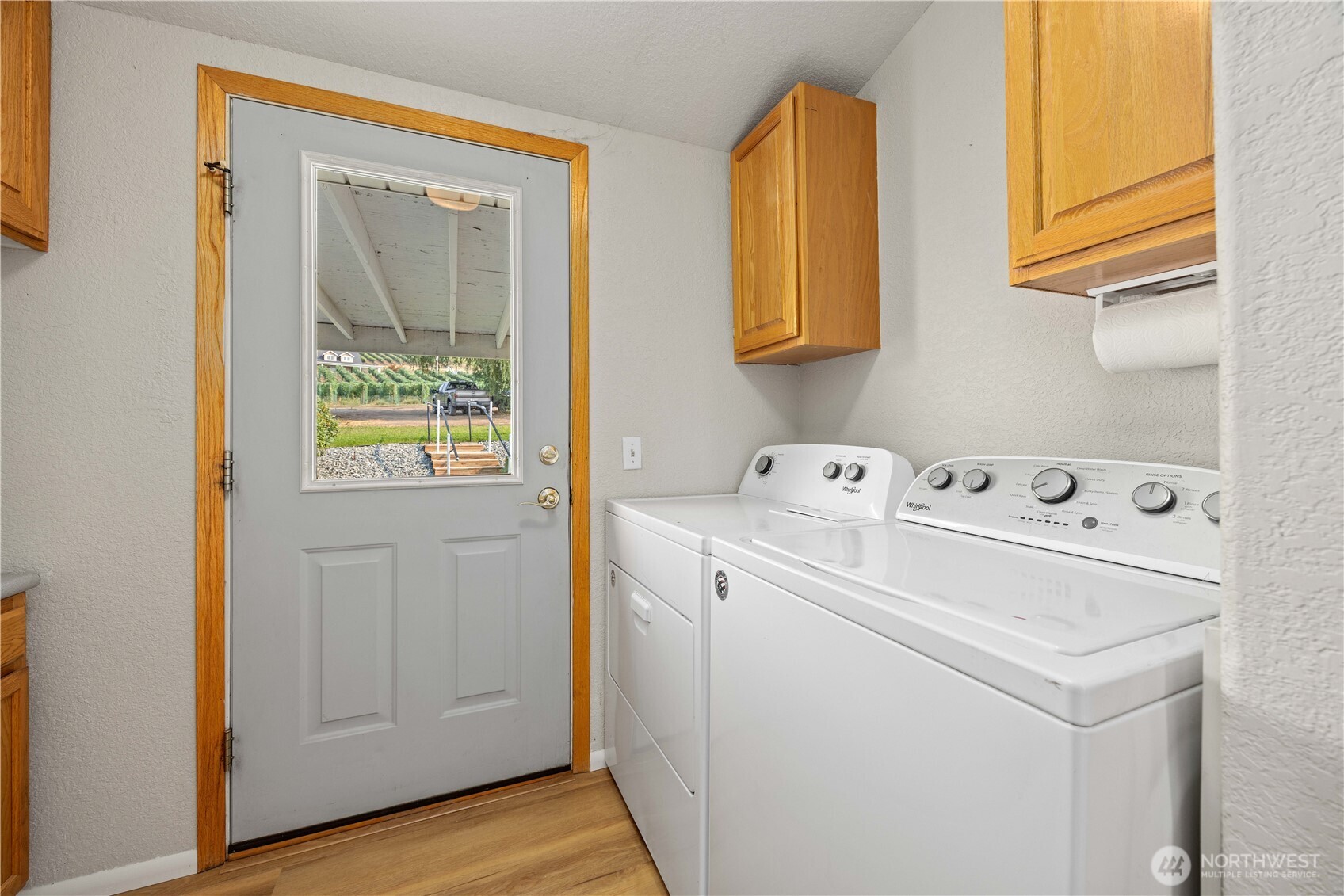 744 Wapato Lake Road Manson, WA 98831 - Photo 14 of 40 a utility room with dryer and washer