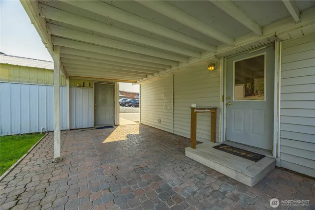a view of utility room with closet and windows