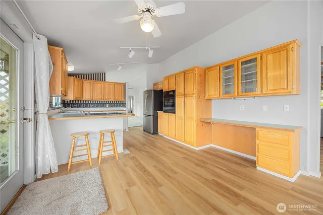 a view of a two chairs in the balcony