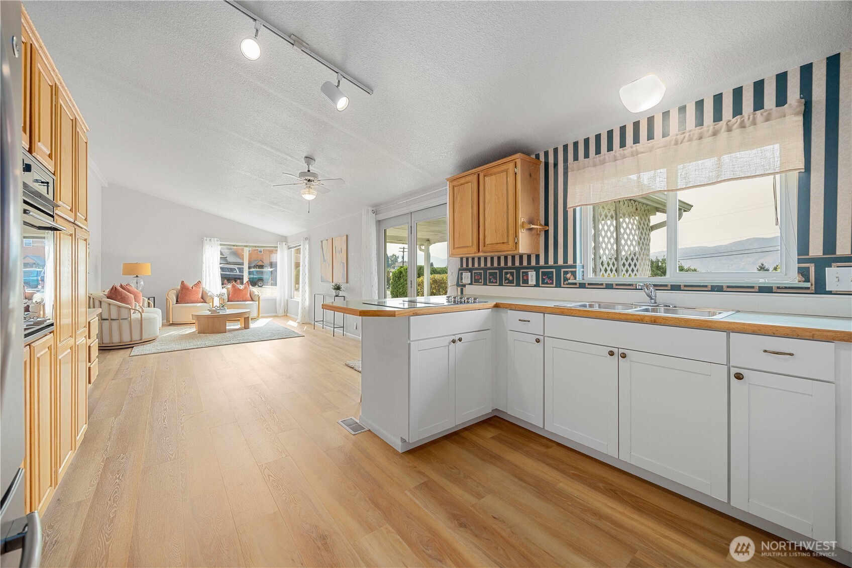 744 Wapato Lake Road Manson, WA 98831 - Photo 25 of 40 a large white kitchen with a large window