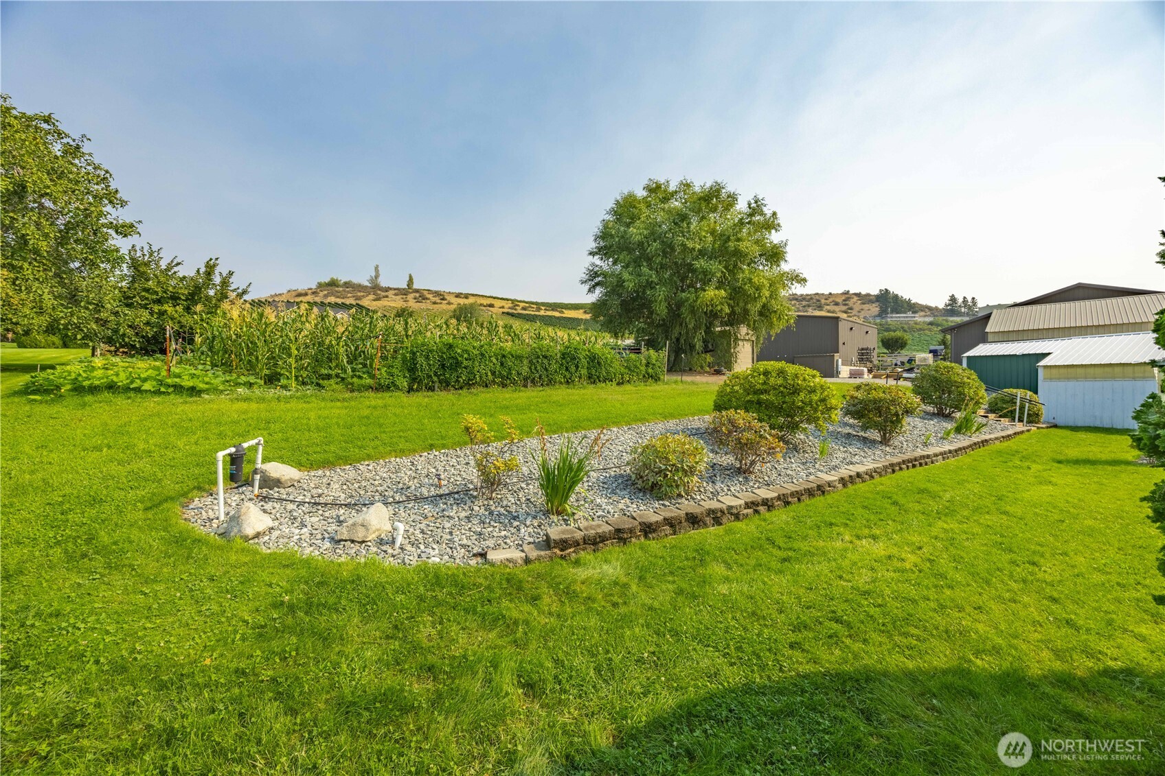 744 Wapato Lake Road Manson, WA 98831 - Photo 28 of 40 a view of a golf course with a garden