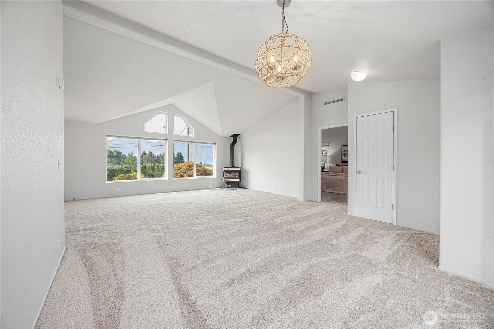 744 Wapato Lake Road Manson, WA 98831 - Photo 3 of 40 a view of a livingroom with a chandelier