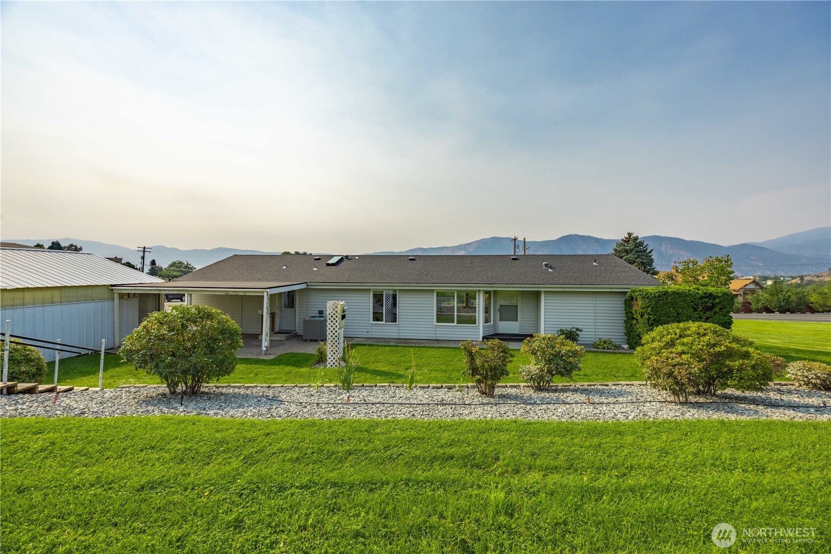 744 Wapato Lake Road Manson, WA 98831 - Photo 31 of 40 a front view of house with yard and green space