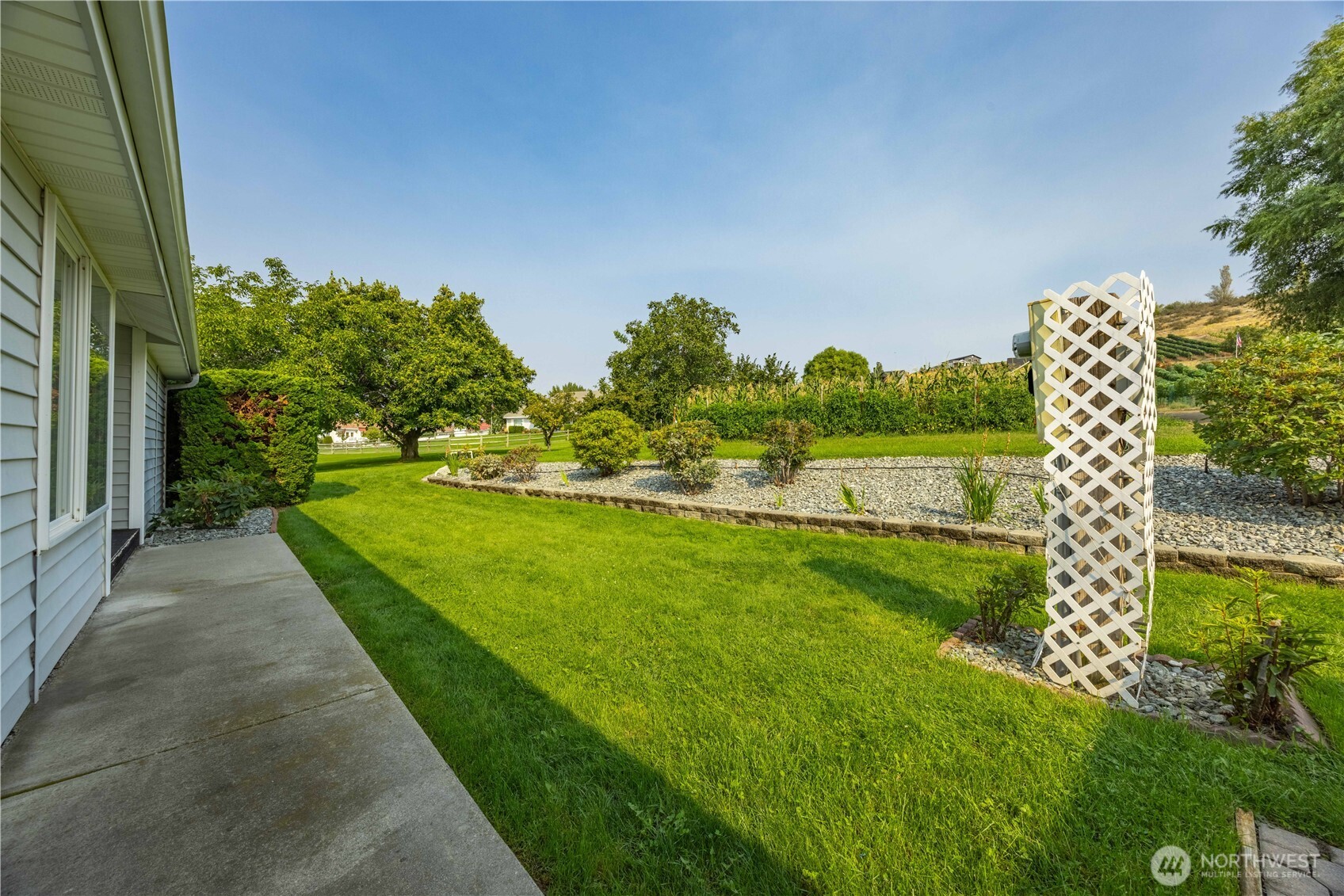 744 Wapato Lake Road Manson, WA 98831 - Photo 35 of 40 a view of a garden with houses