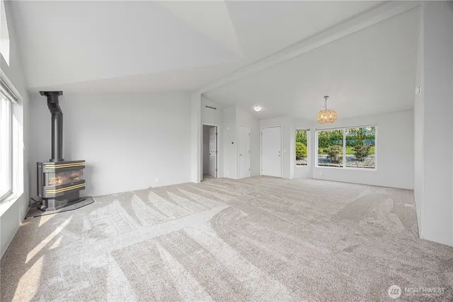 a view of empty room with floor to ceiling window