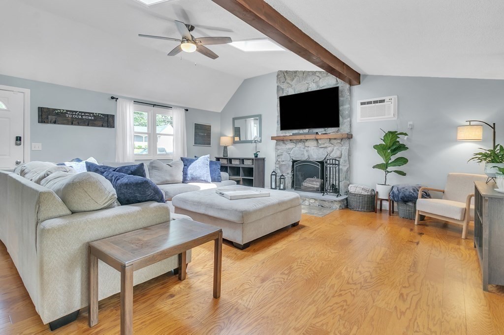 26 Queen Street Enfield, CT 06082 - Photo 15 of 40 a living room with fireplace furniture and a flat screen tv