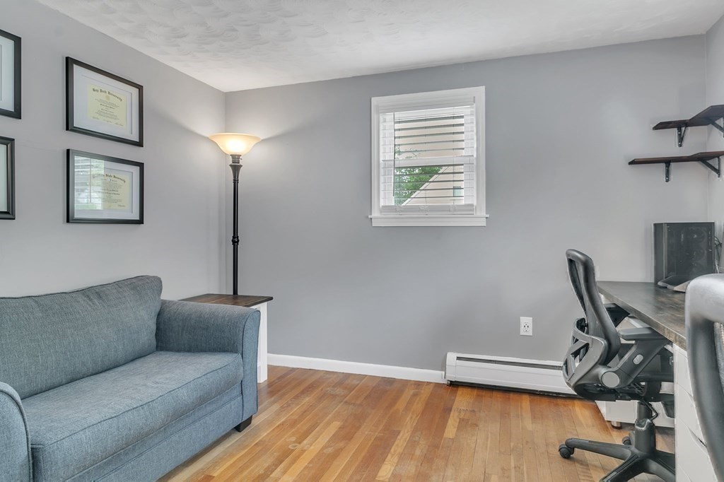 26 Queen Street Enfield, CT 06082 - Photo 20 of 40 a living room with furniture and wooden floor