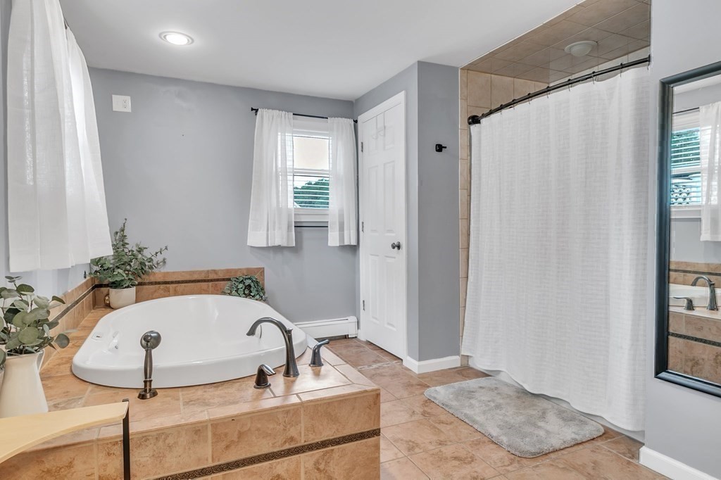 26 Queen Street Enfield, CT 06082 - Photo 22 of 40 a bathroom with a sink and a mirror
