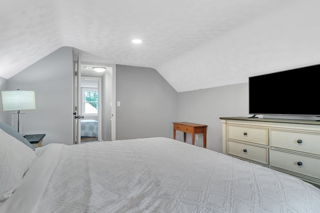26 Queen Street Enfield, CT 06082 - Photo 26 of 40 a bedroom with a bed and a flat screen tv