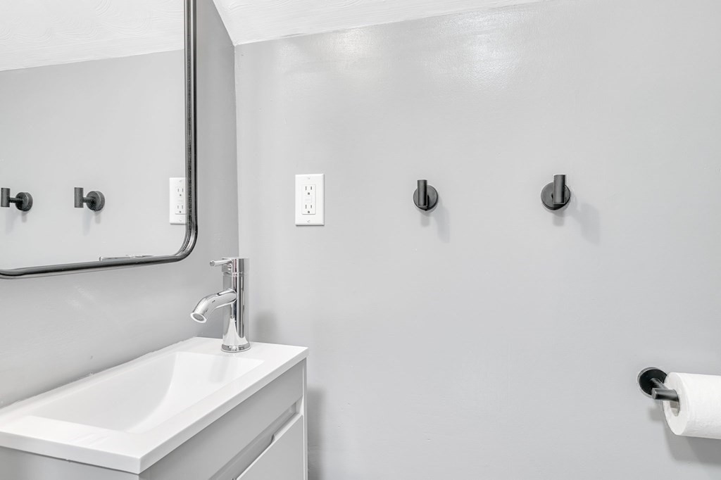 26 Queen Street Enfield, CT 06082 - Photo 27 of 40 a bathroom with a sink and mirror