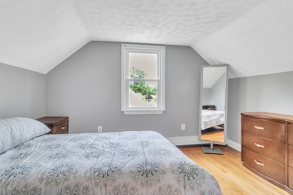 26 Queen Street Enfield, CT 06082 - Photo 28 of 40 a bedroom with a bed and a dresser