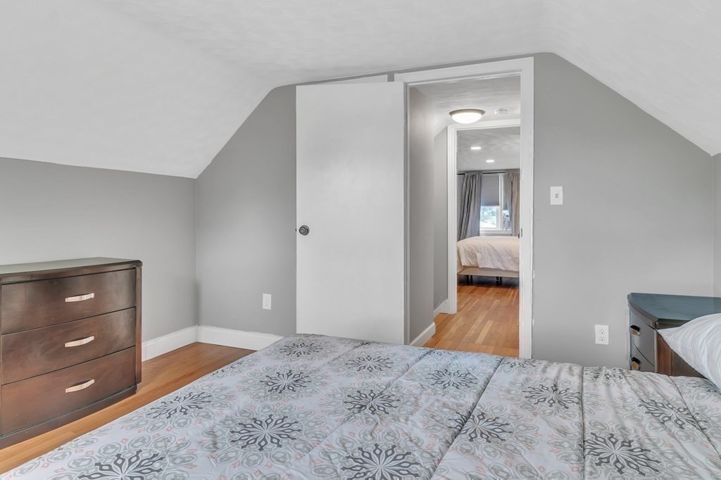 26 Queen Street Enfield, CT 06082 - Photo 29 of 40 a bedroom with a bed and a dresser