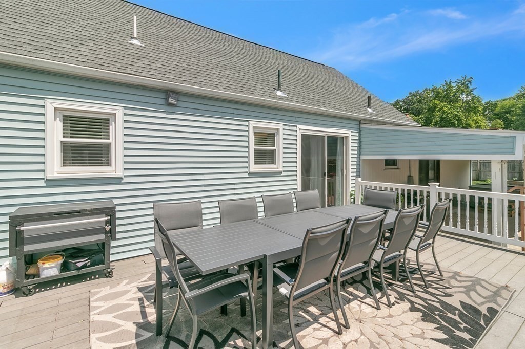 26 Queen Street Enfield, CT 06082 - Photo 34 of 40 a roof deck with a dining table and chairs with wooden floor