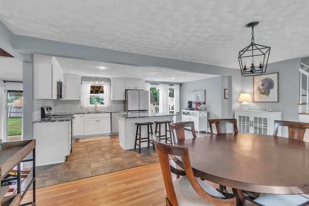 26 Queen Street Enfield, CT 06082 - Photo 9 of 40 a view of kitchen and dining room with wooden floor
