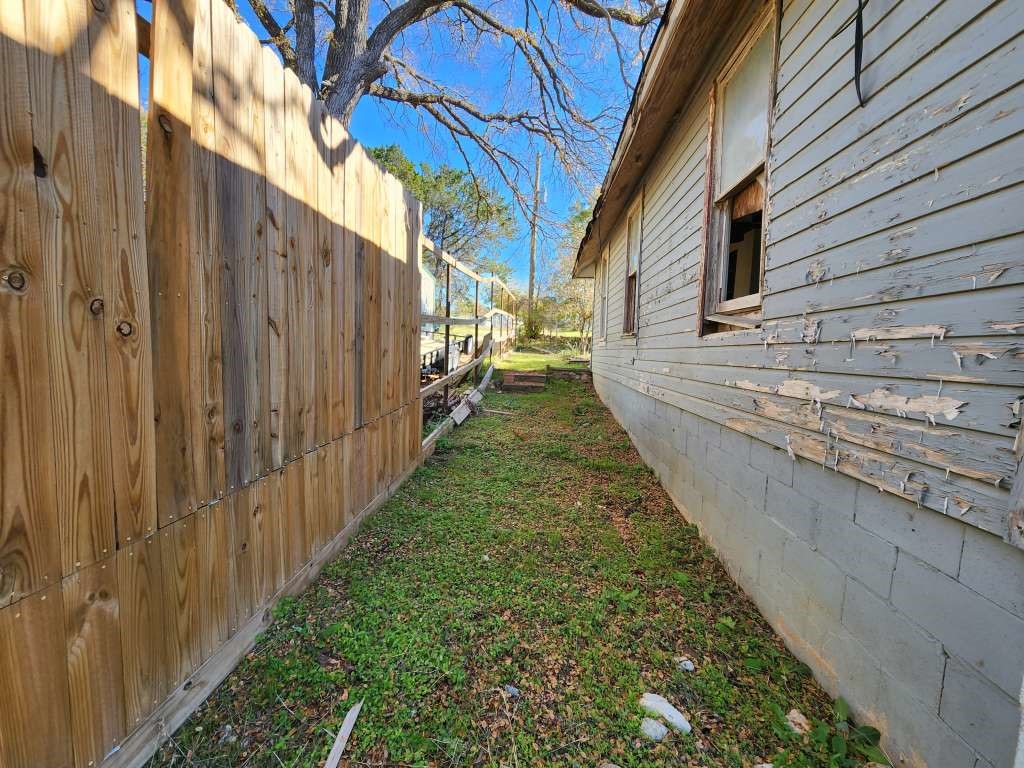 296 Live Oak Loop Whitney, TX 76692 - Photo 3 of 11 a view of a backyard with pathway
