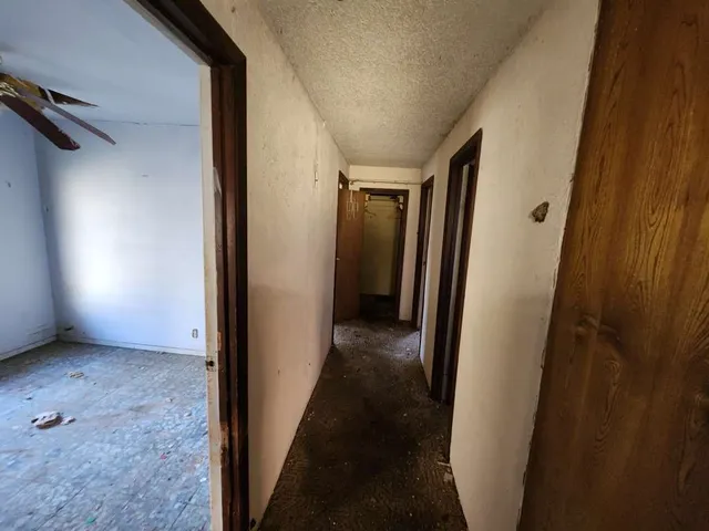 a view of hallway with closet