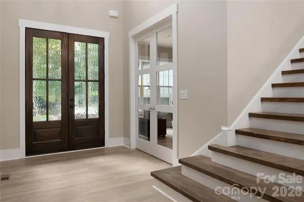 a kitchen with stainless steel appliances a refrigerator and a stove