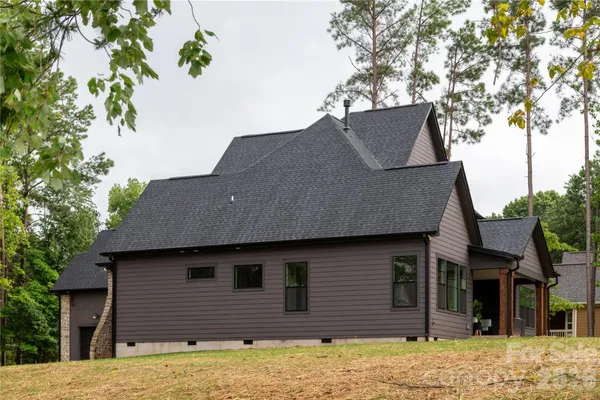 a house that has a tree in front of it