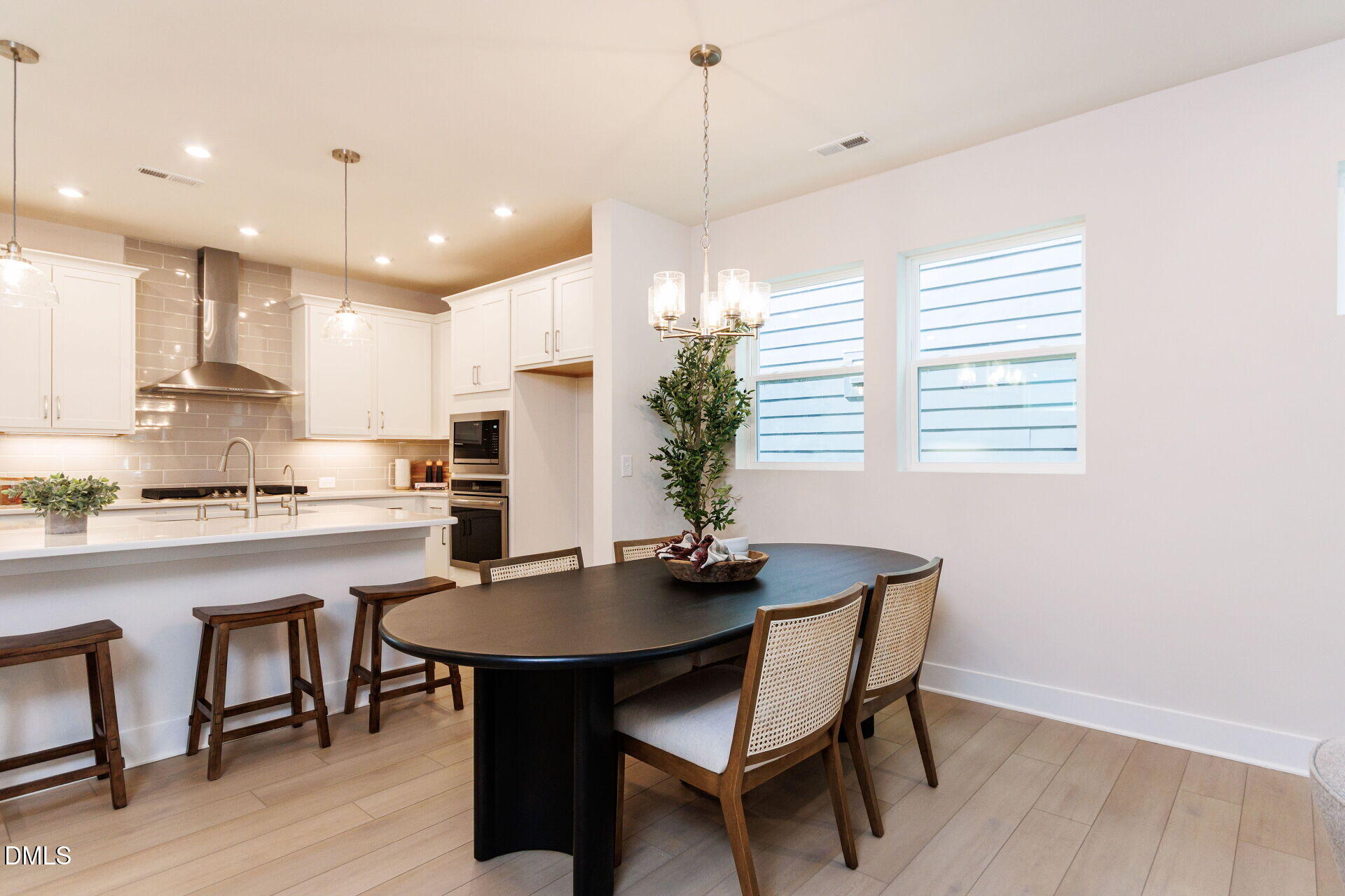 32 Relaxing Way Pittsboro, NC 27312 - Photo 11 of 32 a kitchen with kitchen island a dining table and chairs