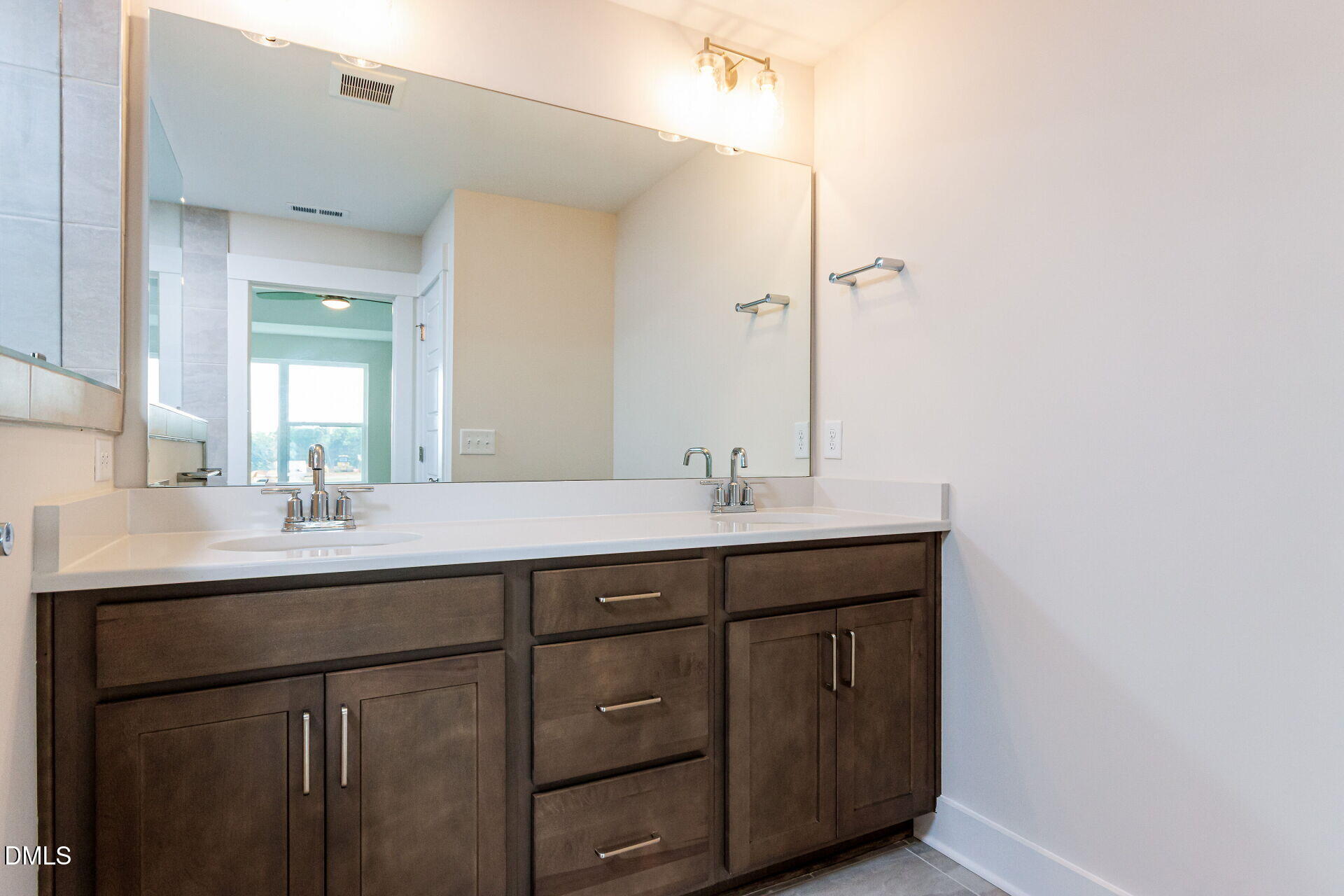 32 Relaxing Way Pittsboro, NC 27312 - Photo 18 of 32 a bathroom with a double vanity sink and mirror