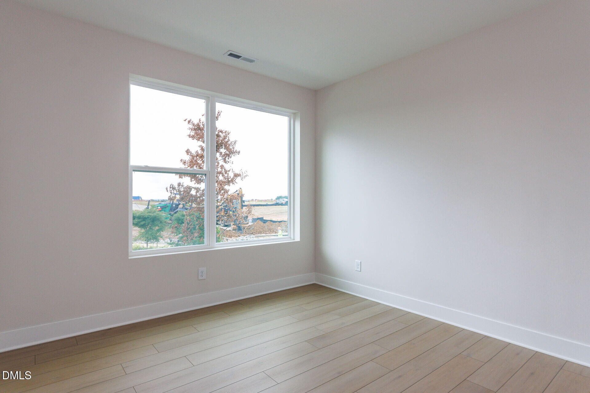32 Relaxing Way Pittsboro, NC 27312 - Photo 5 of 32 an empty room with wooden floor and windows