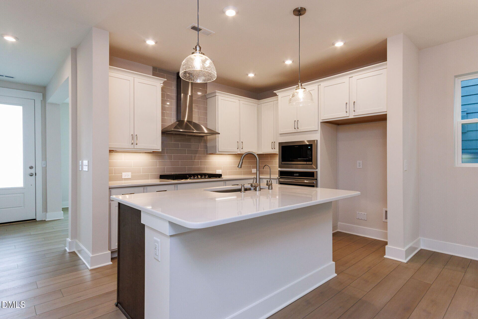 32 Relaxing Way Pittsboro, NC 27312 - Photo 7 of 32 a large kitchen with stainless steel appliances kitchen island a large island in the center