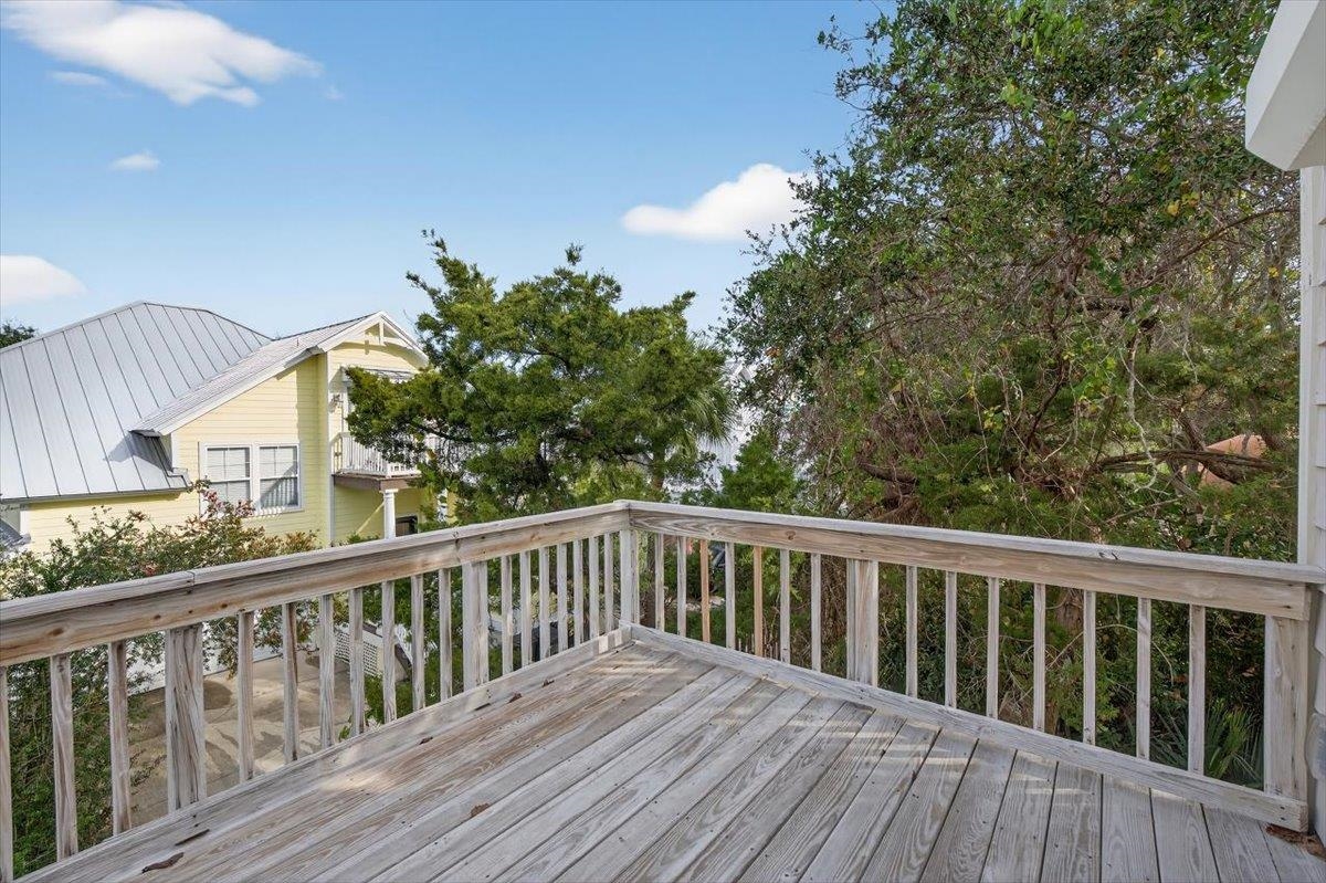6 Manatee Court St. Augustine, FL 32080 - Photo 24 of 71 a balcony with wooden floor and fence