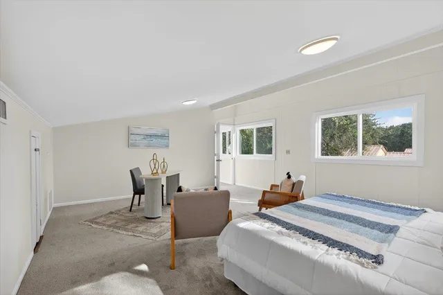 a balcony with wooden floor and fence