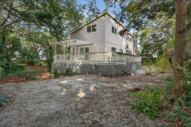 a kitchen with stainless steel appliances granite countertop a sink a stove a oven a dining table and chairs