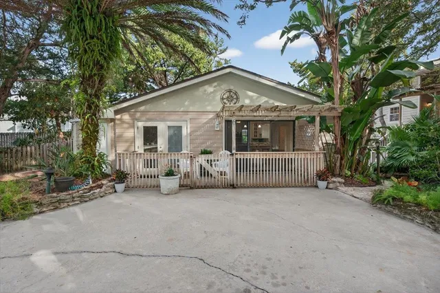 a kitchen with granite countertop a sink stove and cabinets