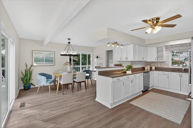 a view of a house with a tree