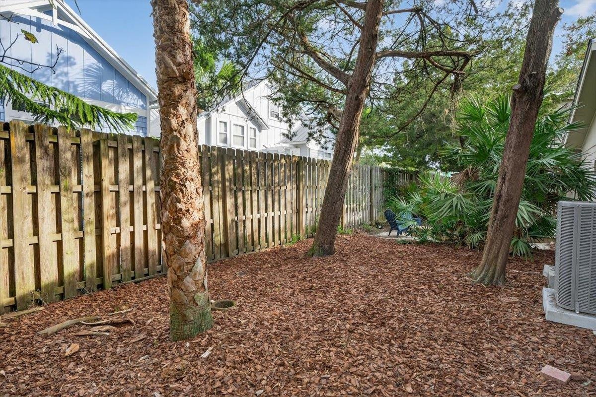 6 Manatee Court St. Augustine, FL 32080 - Photo 47 of 71 a view of a yard with wooden fence and a large tree