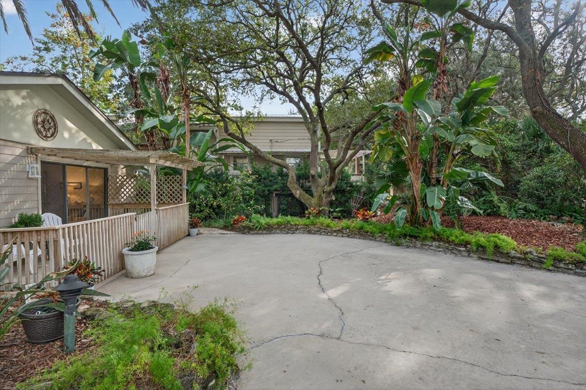 6 Manatee Court St. Augustine, FL 32080 - Photo 55 of 71 a view of a house with potted plants and large trees