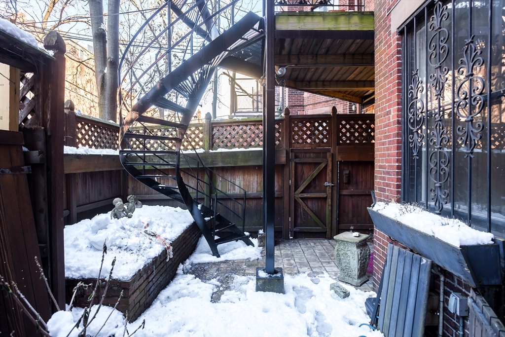 327 Commonwealth Avenue, Unit 2 Boston, MA 02115 - Photo 16 of 17 a view of a chairs and table in the patio
