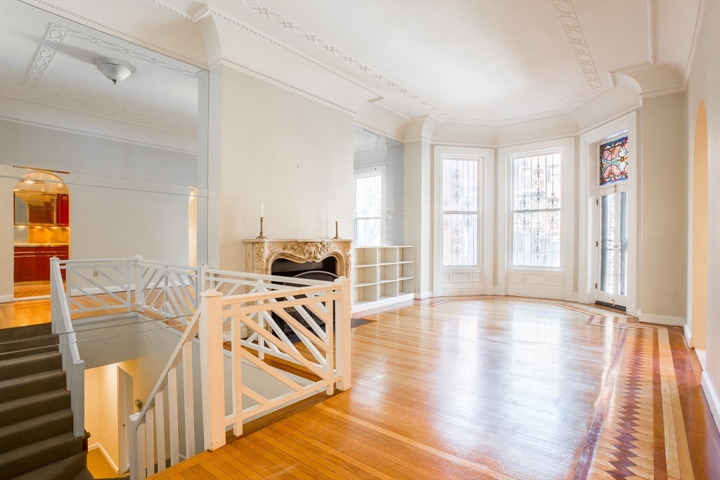 327 Commonwealth Avenue, Unit 2 Boston, MA 02115 - Photo 7 of 17 a view of a kitchen with furniture and wooden floor