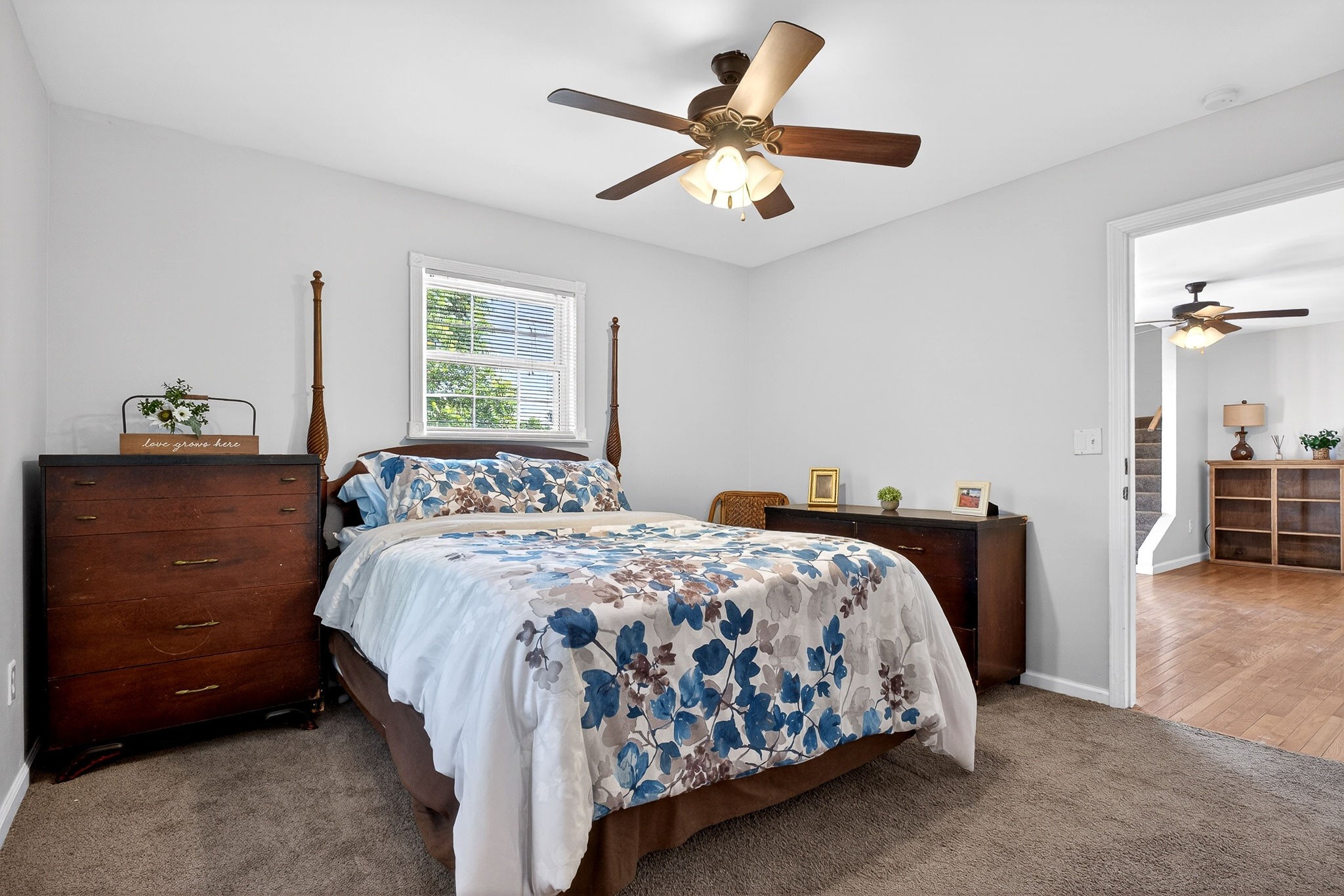 412 Rock Station Road Rock Island, TN 38581 - Photo 14 of 47 a bedroom with a bed and a chandelier