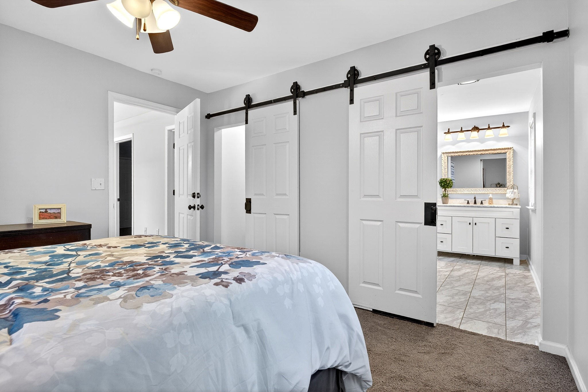 412 Rock Station Road Rock Island, TN 38581 - Photo 15 of 47 a spacious bedroom with a bed and a chandelier