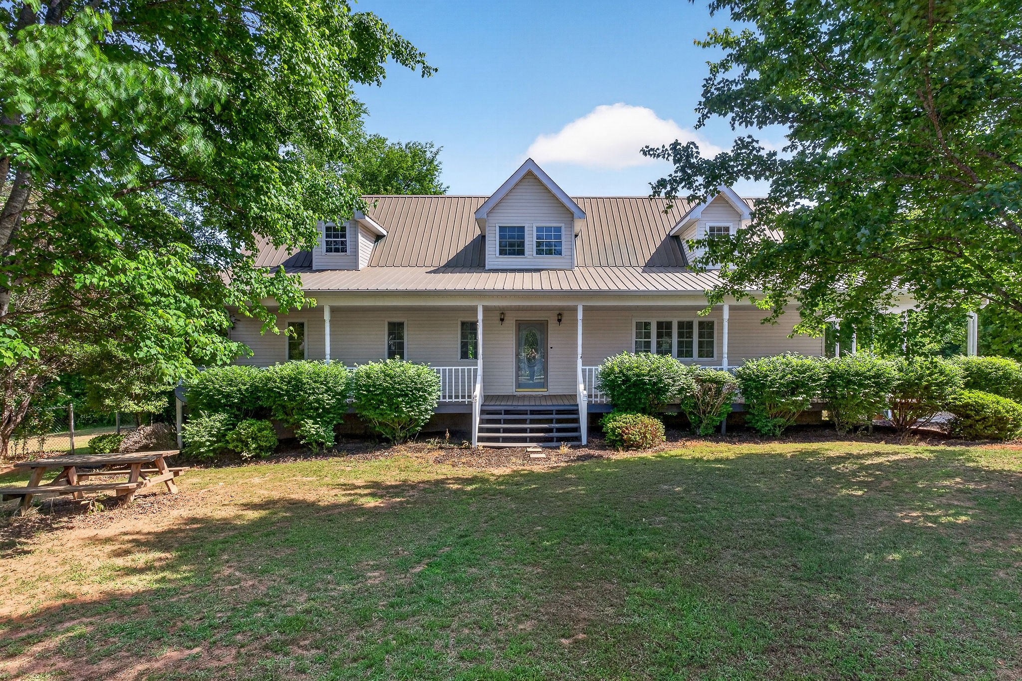 412 Rock Station Road Rock Island, TN 38581 - Photo 2 of 47 a front view of a house with a yard