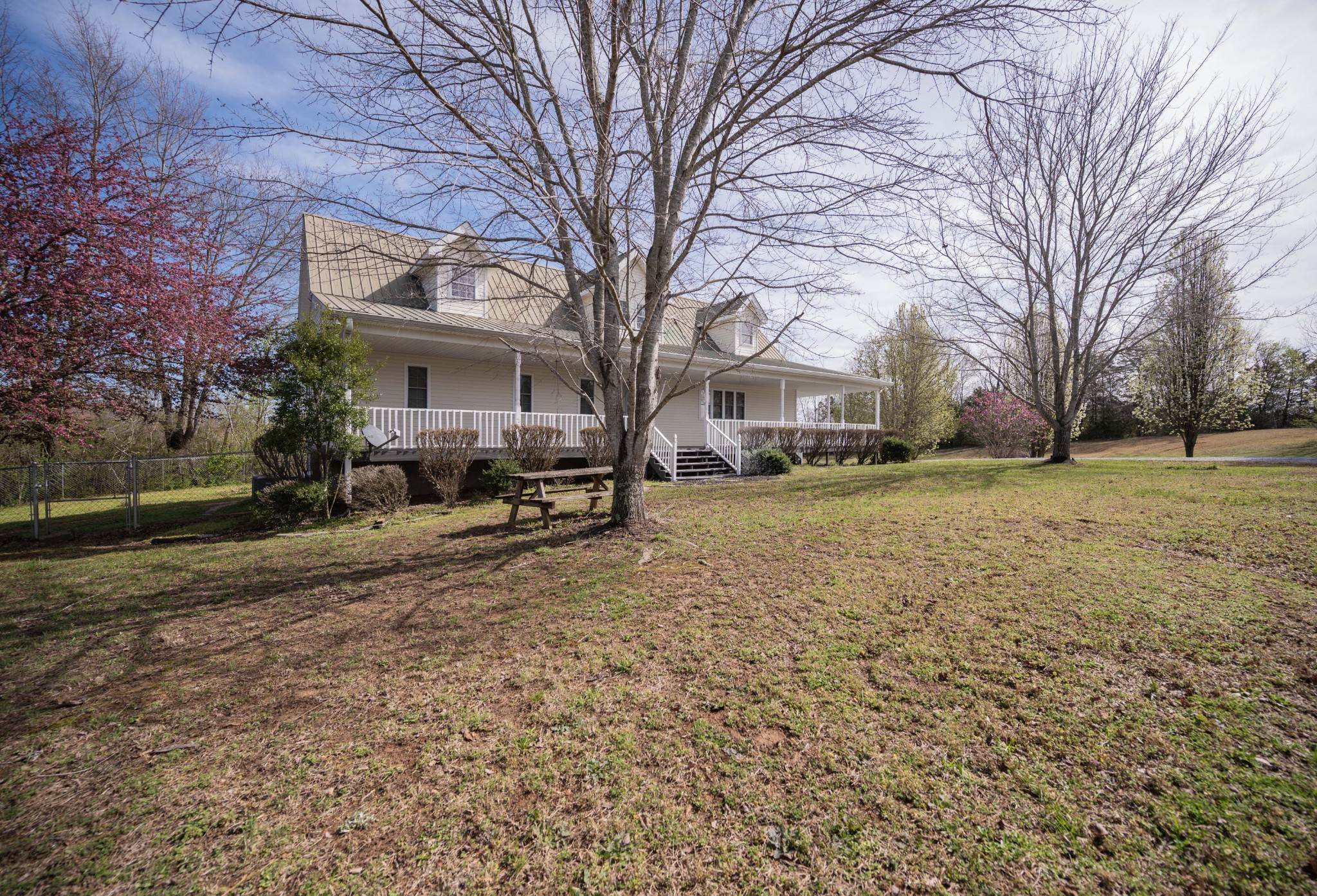 412 Rock Station Road Rock Island, TN 38581 - Photo 47 of 47 a view of a yard with a large tree in front of it