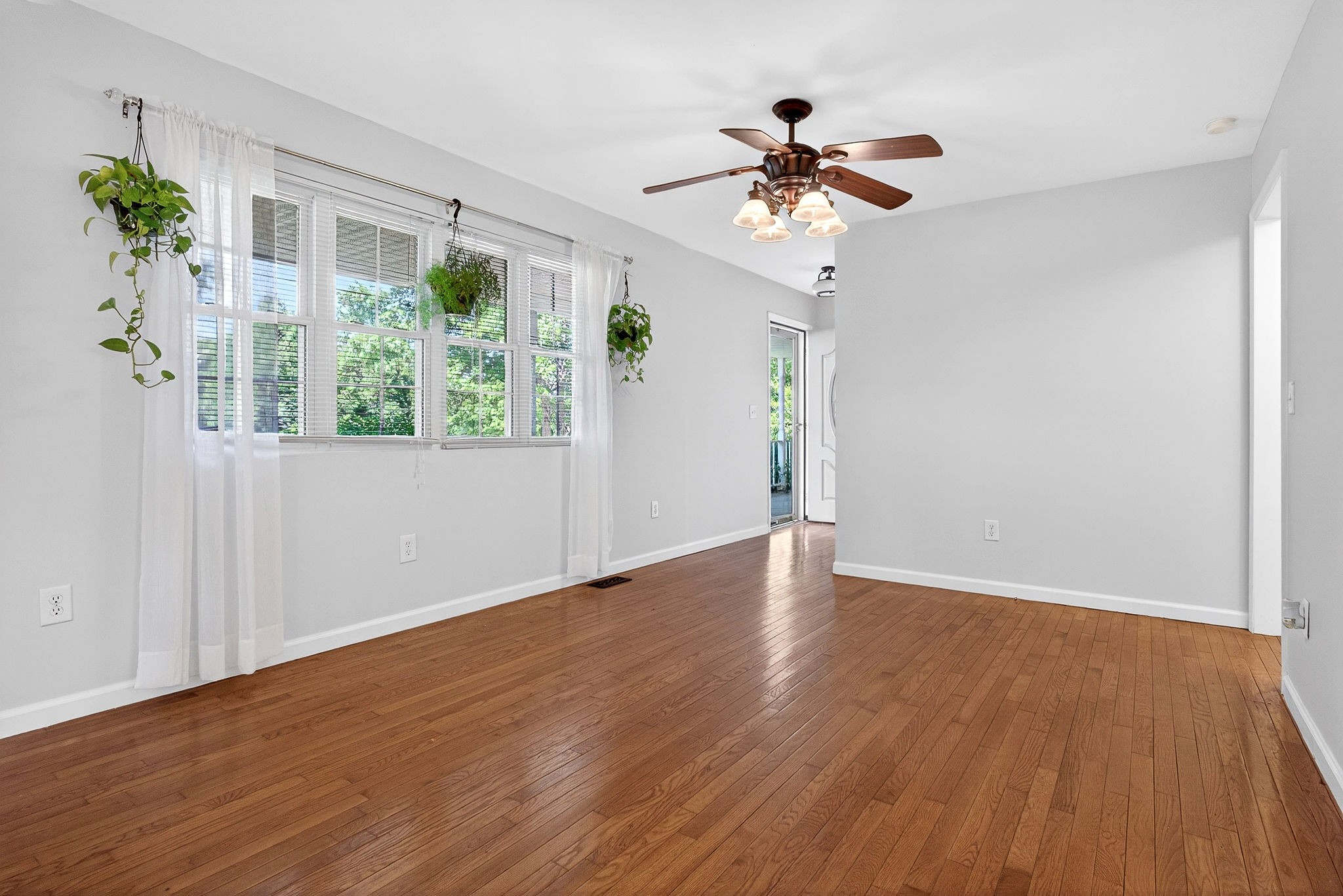 412 Rock Station Road Rock Island, TN 38581 - Photo 6 of 47 a view of an empty room with wooden floor and a window