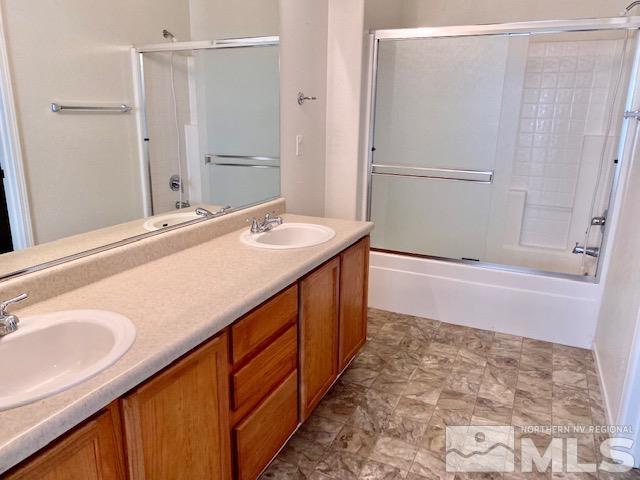 7622 Corso Street Reno, NV 89506 - Photo 9 of 19 a bathroom with a sink and a mirror