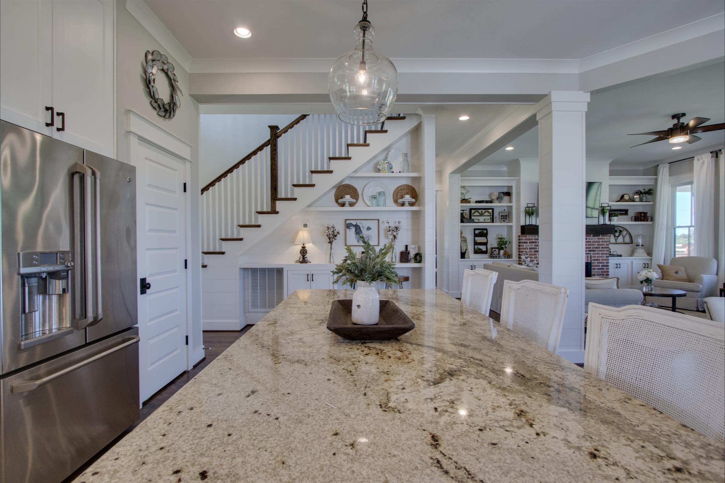 2845 Beech Log Road Watertown, TN 37184 - Photo 11 of 30 a kitchen with stainless steel appliances kitchen island granite countertop a refrigerator a stove and a sink