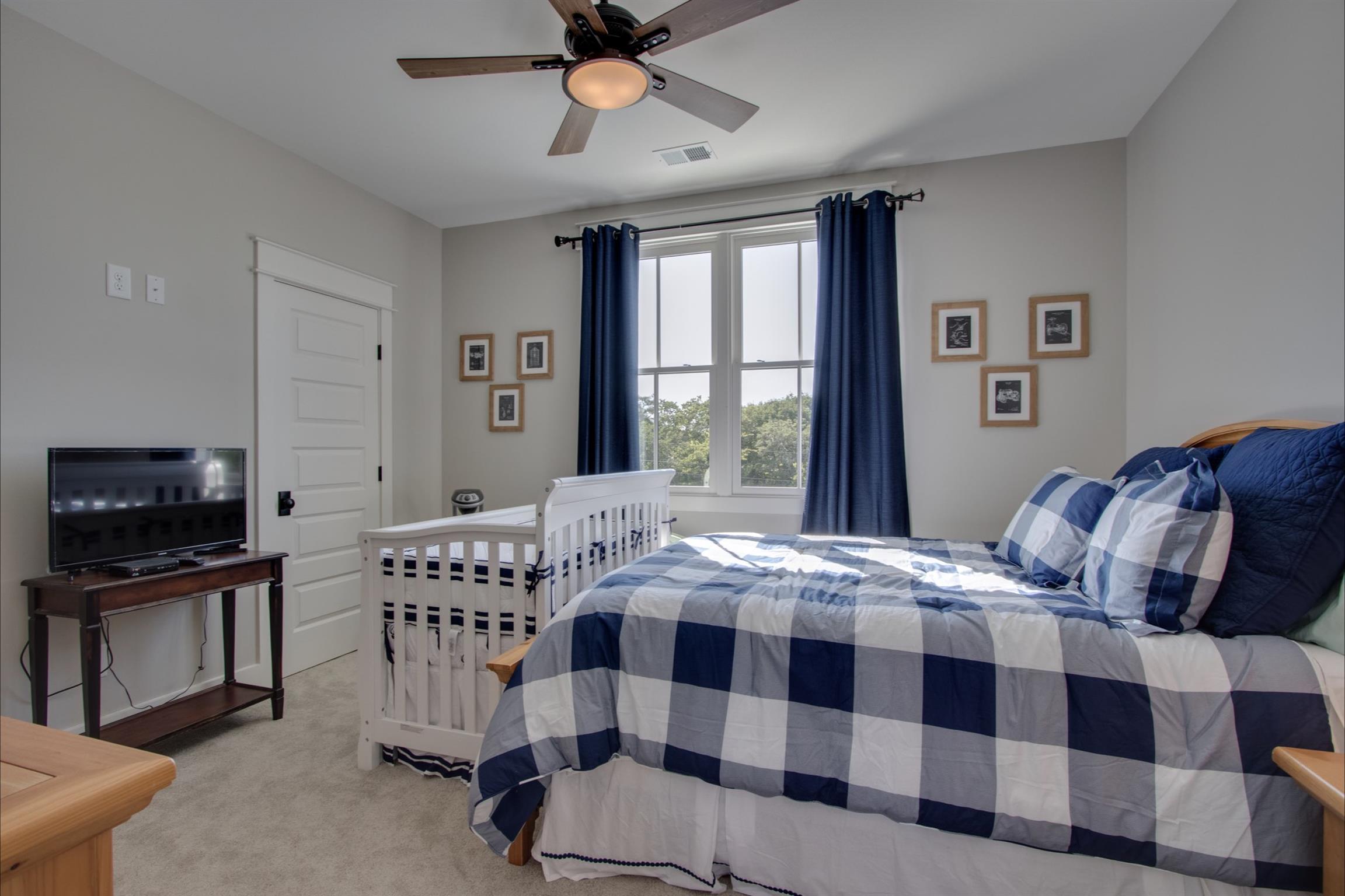 2845 Beech Log Road Watertown, TN 37184 - Photo 19 of 30 a bedroom with a bed and a flat screen tv