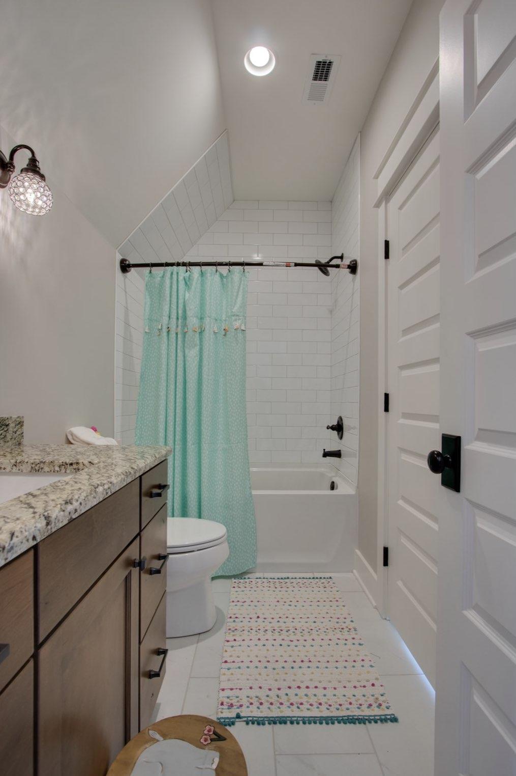 2845 Beech Log Road Watertown, TN 37184 - Photo 22 of 30 a bathroom with a granite countertop sink toilet and shower