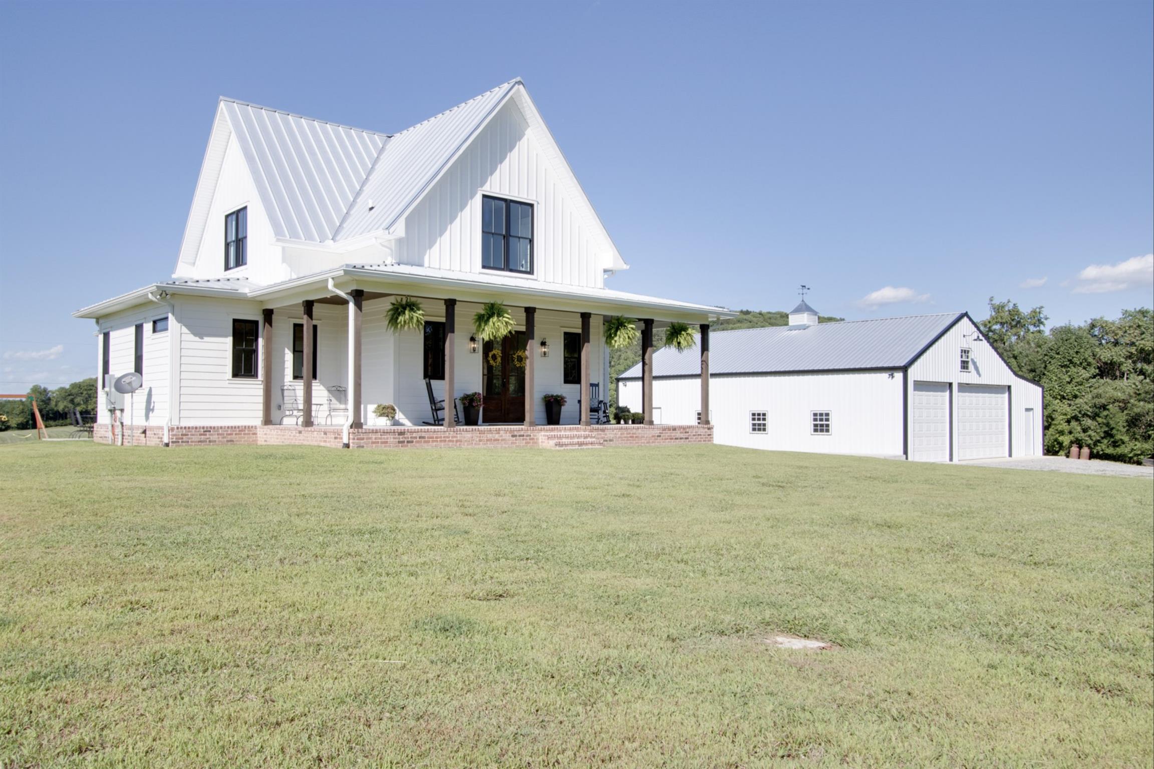 2845 Beech Log Road Watertown, TN 37184 - Photo 4 of 30 a front view of a house with a garden and trees