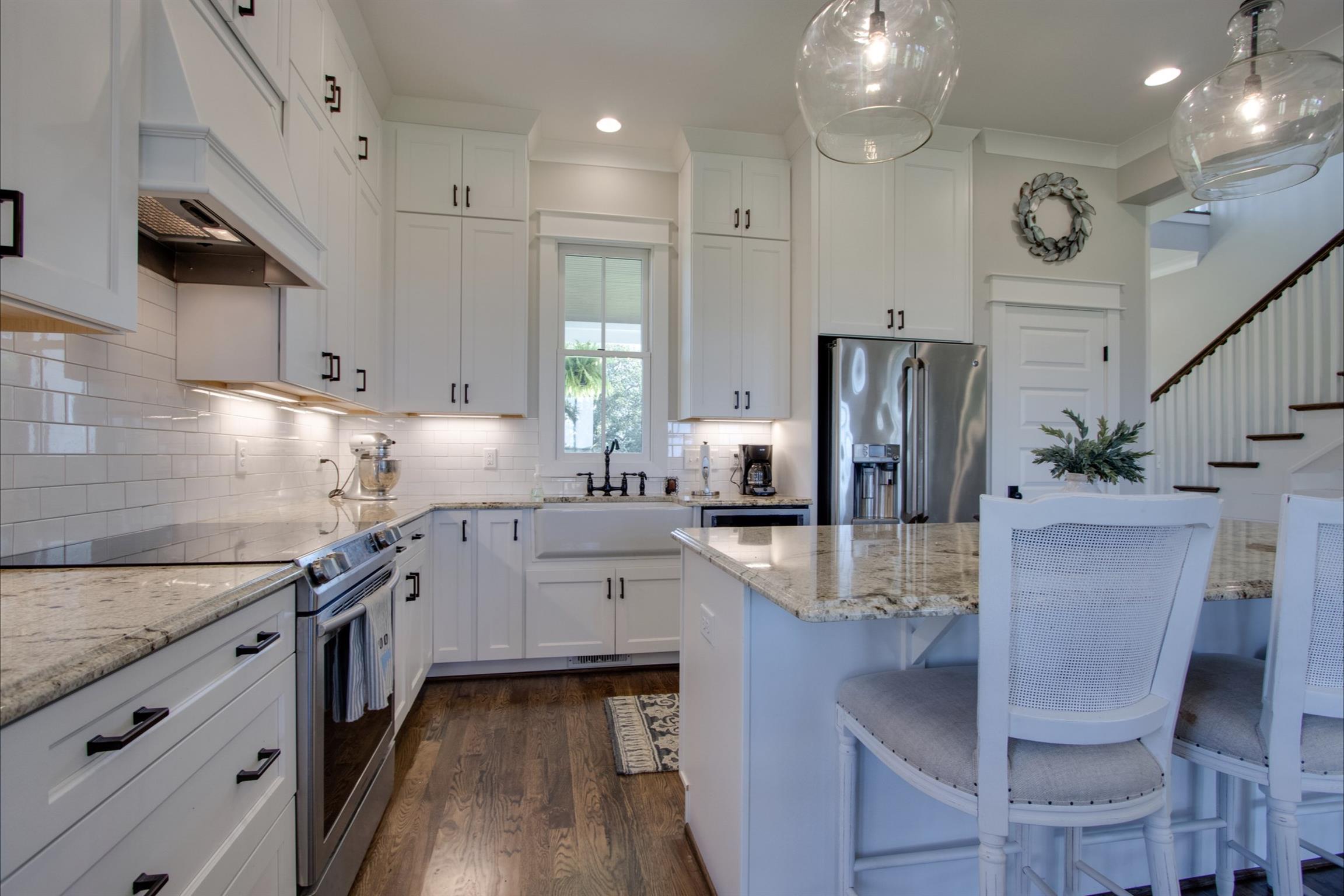 2845 Beech Log Road Watertown, TN 37184 - Photo 9 of 30 a kitchen with stainless steel appliances granite countertop a kitchen island hardwood floor sink and stove