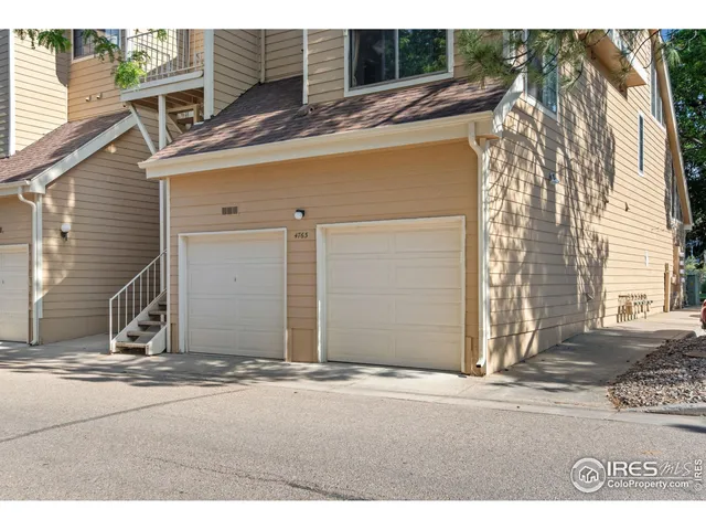 a view of a house with a street