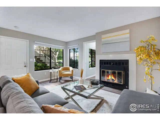 a kitchen with a sink and living room