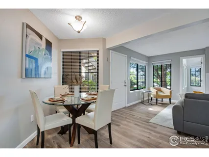 a dining room with furniture and window