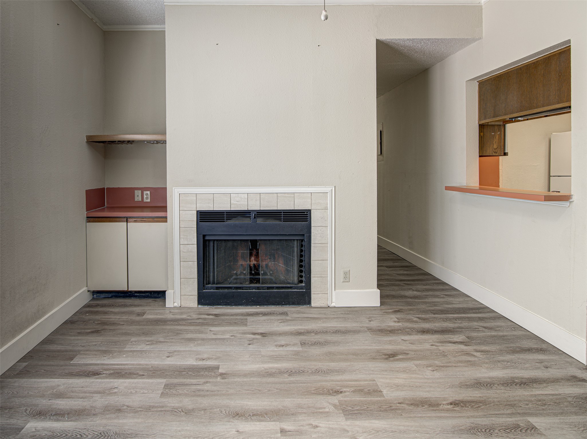 2804 Rio Grande Street, Unit 208 Austin, TX 78705 - Photo 3 of 24 A cozy living area features a charming fireplace, perfect for relaxation.